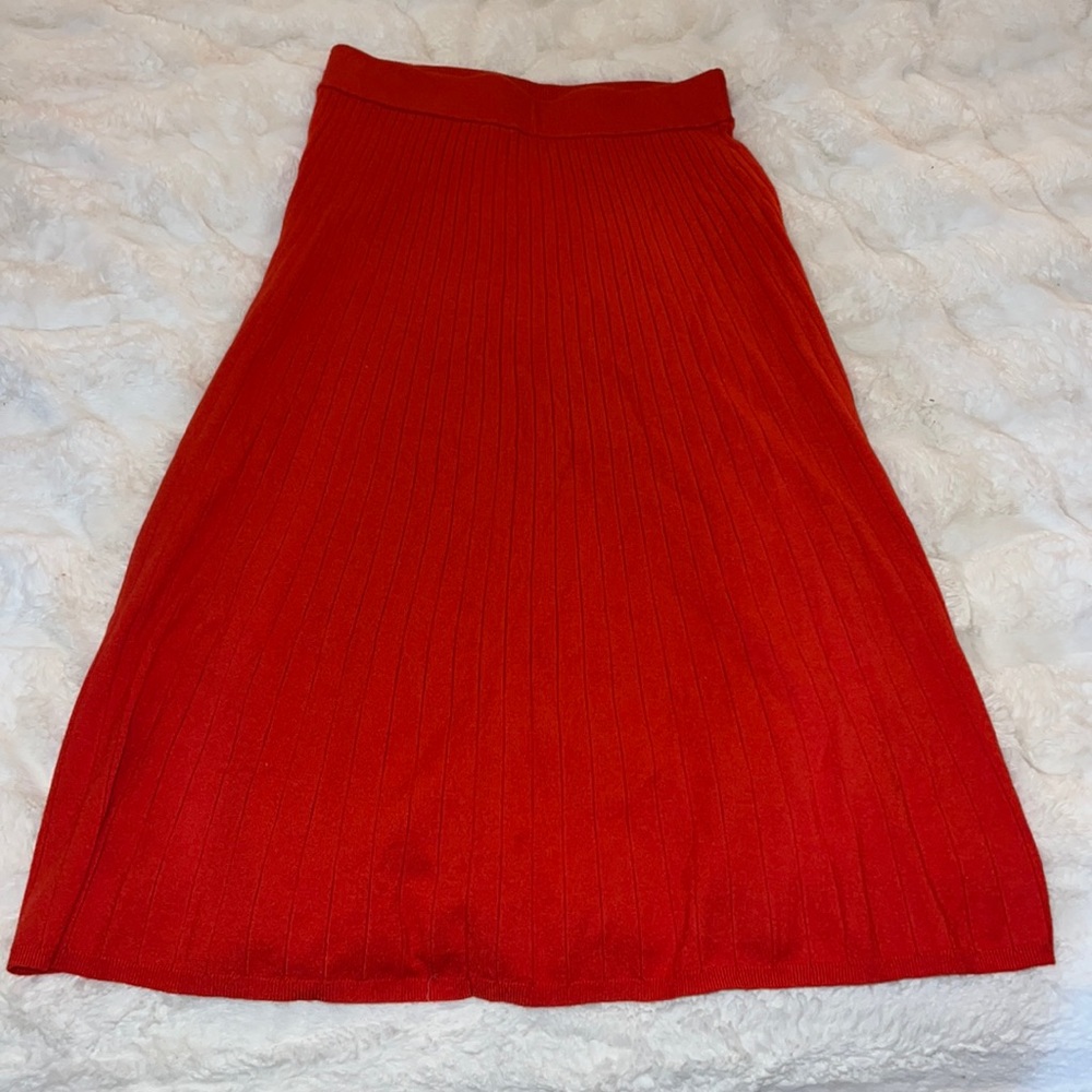 Red ribbed sweater midi skirt. Color is an orangish red. Soft and cozy, NWT.